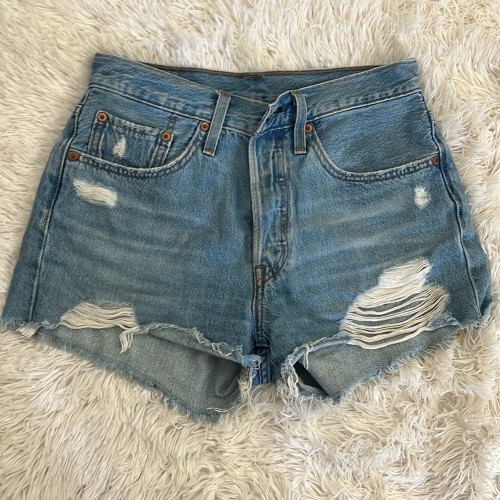 Levi’s 501 cut off distressed, denim shorts. Light wash